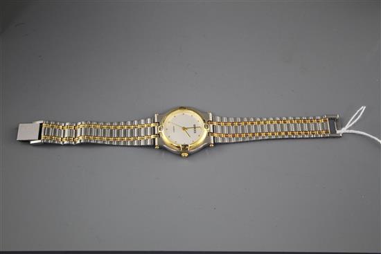 A modern stainless steel and yellow metal Gucci quartz dress wristwatch, on steel and yellow metal bracelet,